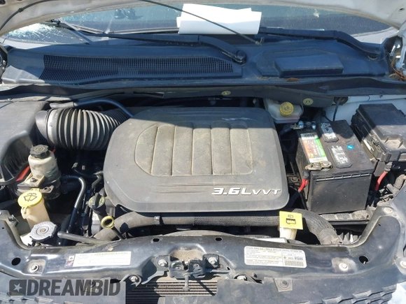 2013 Dodge Grand Caravan SE with VIN 2C4RDGBG9DR516044, listed as a IAAI auction lot 41998893 with 214,645 mi miles and . Bid and sale history available at DreamBid. Image 10.