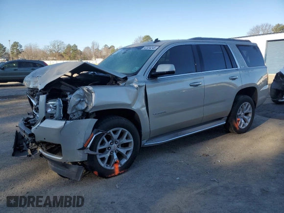2015 GMC Yukon SLE with VIN 1GKS1AKC4FR265208, listed as a Copart auction lot 42324245 with 105,760 mi miles and Salvage Title. Bid and sale history available at carsss.com. Image 1.