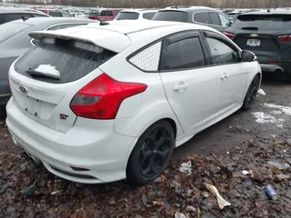 2014 Ford Focus ST with VIN 1FADP3L94EL256548, listed as a IAAI auction lot 40936756 with 79,340 mi miles and . Bid and sale history available at carsss.com. Image 4.