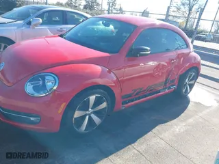 2012 Volkswagen Beetle 2.0T Turbo w/Sun/Sound with VIN 3VWV67ATXCM650376, listed as a IAAI auction lot 41315431 with 104,523 mi miles. Bid and sale history available at carsss.com. Image 6.