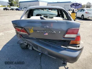 1999 Nissan Maxima GXE z VIN JN1CA21D9XM409448, wystawiony jako Copart lot #51822895 z przebiegiem Nie podano mil oraz Szkoda całkowita • Salvage title. Historia ofert i sprzedaży dostępna na DreamBid. Obrazek 6.