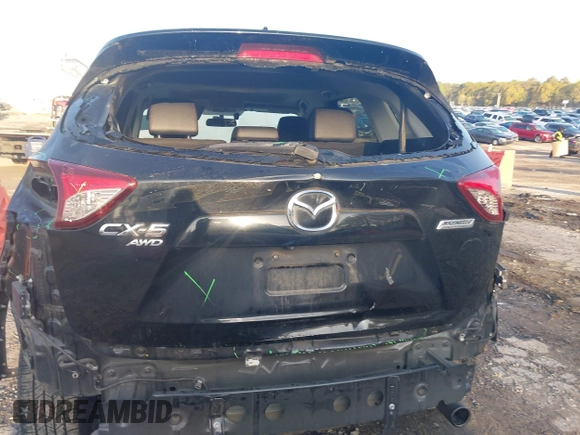 2015 Mazda CX-5 Grand Touring with VIN JM3KE4DY6F0513173, listed as a IAAI auction lot 41867030 with 93,770 mi miles. Bid and sale history available at carsss.com. Image 16.