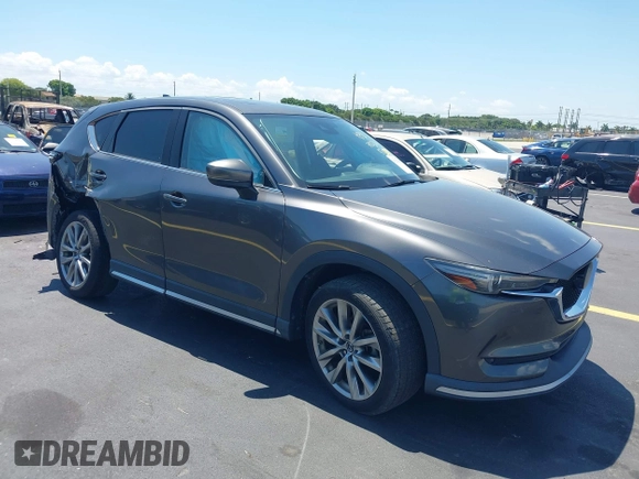 2018 Mazda CX-5 Grand Touring with VIN JM3KFADM8J1310328, listed as a IAAI auction lot 42322780 with 106,378 mi miles and . Bid and sale history available at DreamBid. Image 1.