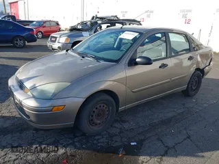 2004 Ford Focus SE with VIN 1FAFP34354W167961, listed as a IAAI auction lot 41545304 with 128,560 mi miles and . Bid and sale history available at DreamBid. Image 18.