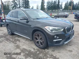 2016 BMW X1 xDrive28i with VIN WBXHT3C32G5E53511, listed as a IAAI auction lot 42002327 with 197,417 mi miles. Bid and sale history available at carsss.com. Image 1.