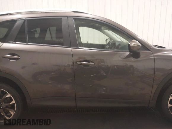 2016 Mazda CX-5 Grand Touring with VIN JM3KE4DY0G0732843, listed as a IAAI auction lot 41520889 with 149,798 mi miles. Bid and sale history available at carsss.com. Image 13.