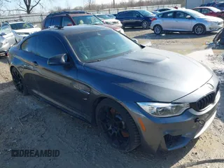 2015 BMW M4 with VIN WBS3R9C57FK334921, listed as a IAAI auction lot 41869773 with 107,058 mi miles. Bid and sale history available at carsss.com. Image 1.