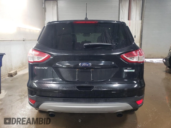 2015 Ford Escape SE with VIN 1FMCU0GX4FUC57258, listed as a Copart auction lot 51085685 with 216,724 mi miles and Salvage Title. Bid and sale history available at DreamBid. Image 6.