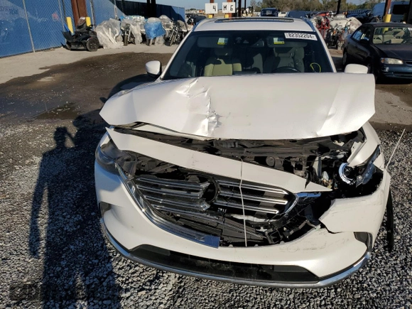 2017 Mazda CX-9 Grand Touring z VIN JM3TCADYXH0127867, wystawiony jako Copart lot #82352204 z przebiegiem 129 349 mil mil oraz Szkoda całkowita • Salvage title. Historia ofert i sprzedaży dostępna na DreamBid. Obrazek 12.
