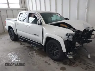2023 Toyota Tacoma SR with VIN 3TMCZ5AN4PM643095, listed as a IAAI auction lot 41975119 with 13,632 mi miles and . Bid and sale history available at DreamBid. Image 1.