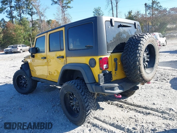 2015 Jeep Wrangler Unlimited Rubicon z VIN 1C4BJWFG4FL681946, wystawiony jako IAAI lot #40809597 z przebiegiem 57 148 mil mil oraz . Historia ofert i sprzedaży dostępna na DreamBid. Obrazek 3.