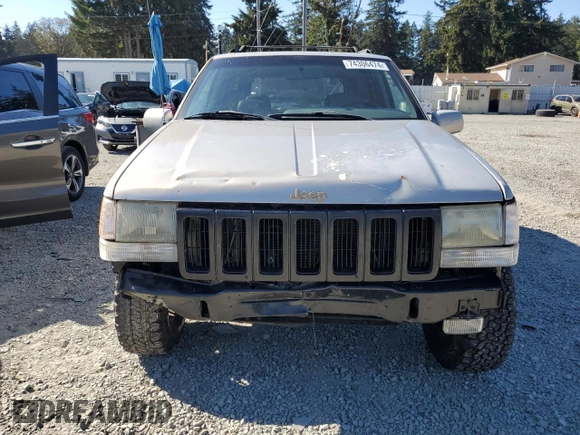 1997 Jeep Grand Cherokee Limited with VIN 1J4GZ78Y5VC598822, listed as a Copart auction lot 74306474 with 276,454 mi miles and Salvage Title. Bid and sale history available at carsss.com. Image 5.