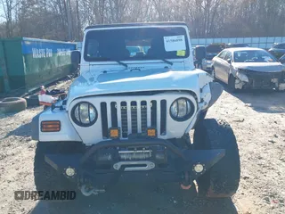 2005 Jeep Wrangler Unlimited with VIN 1J4FA44SX5P316055, listed as a IAAI auction lot 41586898 with 218,181 mi miles. Bid and sale history available at carsss.com. Image 12.