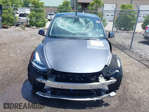 2023 Tesla Model Y Long Range with VIN 7SAYGAEE7PF615751, listed as a IAAI auction lot 42297819 with 31,201 mi miles and . Bid and sale history available at DreamBid. Image 13.