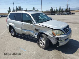 2004 Lexus GX 470 with VIN JTJBT20X640052213, listed as a Copart auction lot 52708415 with 390,451 mi miles and Salvage Title. Bid and sale history available at carsss.com. Image 4.