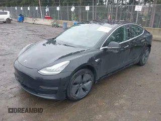 2019 Tesla Model 3 Mid Range with VIN 5YJ3E1EAXKF296378, listed as a IAAI auction lot 41739616 with 77,100 mi miles and . Bid and sale history available at DreamBid. Image 2.
