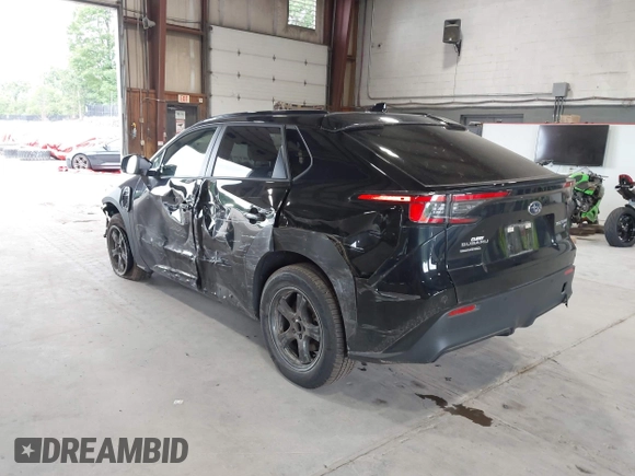 2024 Subaru Solterra Touring with VIN JTMABABA9RA052065, listed as a IAAI auction lot 42648692 with 13,880 mi miles and . Bid and sale history available at DreamBid. Image 3.