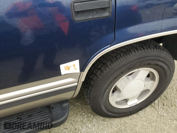 1999 GMC Yukon with VIN 1GKEK13R2XJ739931, listed as a Copart auction lot 74583734 with 115,605 mi miles and Salvage Title. Bid and sale history available at carsss.com. Image 13.