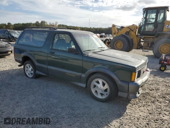 1993 GMC Jimmy z VIN 1GDCT18Z9P0810178, wystawiony jako Copart lot #79442614 z przebiegiem 19 514 mil mil oraz Szkoda całkowita • Salvage title. Historia ofert i sprzedaży dostępna na DreamBid. Obrazek 4.