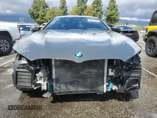 2025 BMW 8 Series M850i with VIN WBAGV8C07SCT18237, listed as a Copart auction lot 49277375 with 750 mi miles and Salvage title. Bid and sale history available at DreamBid. Image 5.