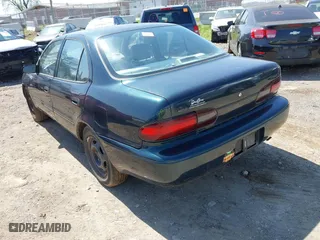 1997 Geo Prizm with VIN 1Y1SK5268VZ462502, listed as a IAAI auction lot 41929276 with 243,149 mi miles. Bid and sale history available at carsss.com. Image 3.