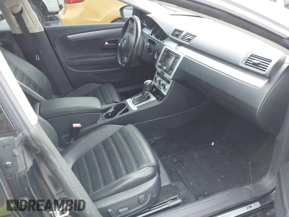 2014 Volkswagen CC R-Line with VIN WVWBN7ANXEE521055, listed as a IAAI auction lot 41197539 with 94,902 mi miles. Bid and sale history available at carsss.com. Image 5.