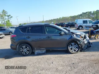 2016 Toyota RAV4 LE with VIN JTMZFREV7GJ065267, listed as a IAAI auction lot 42011267 with 180,127 mi miles. Bid and sale history available at carsss.com. Image 13.