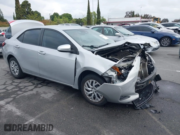 2019 Toyota Corolla L with VIN 5YFBURHE4KP929909, listed as a IAAI auction lot 42078797 with 131,741 mi miles. Bid and sale history available at carsss.com. Image 1.