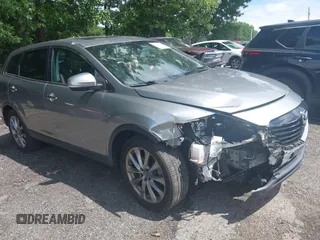 2014 Mazda CX-9 Grand Touring with VIN JM3TB2DA3E0443604, listed as a IAAI auction lot 42456552 with 150,053 mi miles and . Bid and sale history available at DreamBid. Image 1.