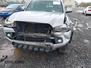 2016 Toyota Tacoma SR with VIN 5TFCZ5AN5GX026458, listed as a IAAI auction lot 41975246 with 208,401 mi miles and . Bid and sale history available at DreamBid. Image 6.