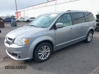 2019 Dodge Grand Caravan SXT with VIN 2C4RDGCG0KR786940, listed as a IAAI auction lot 41648332 with 96,427 mi miles and . Bid and sale history available at DreamBid. Image 18.
