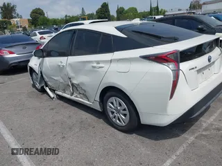 2016 Toyota Prius Two z VIN JTDKBRFU3G3024092, wystawiony jako IAAI lot #42338381 z przebiegiem 87 216 mil mil oraz . Historia ofert i sprzedaży dostępna na DreamBid. Obrazek 3.