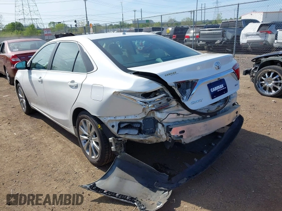 2015 Toyota Camry XLE with VIN 4T1BF1FK1FU977554, listed as a IAAI auction lot 42083589 with 104,811 mi miles and . Bid and sale history available at DreamBid. Image 3.