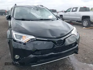 2018 Toyota RAV4 XLE with VIN 2T3WFREV9JW412755, listed as a IAAI auction lot 41889960 with 216,451 mi miles and . Bid and sale history available at carsss.com. Image 6.