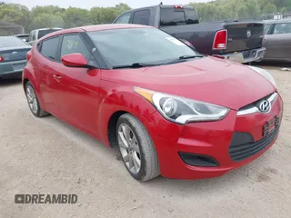 2016 Hyundai Veloster z VIN KMHTC6AD8GU256765, wystawiony jako IAAI lot #42237397 z przebiegiem 111 429 mil mil oraz . Historia ofert i sprzedaży dostępna na DreamBid. Obrazek 1.
