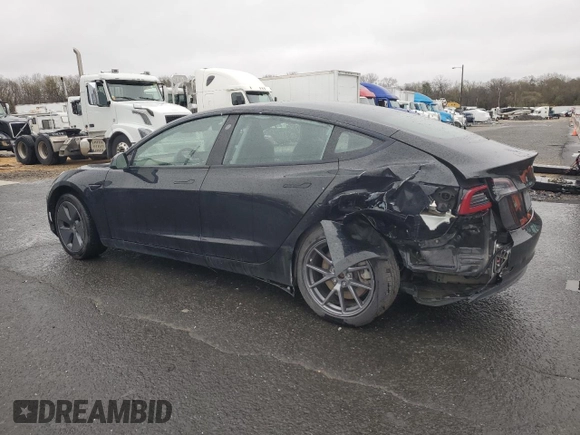 2021 Tesla Model 3 Standard Range Plus with VIN 5YJ3E1EA2MF087879, listed as a Copart auction lot 51853235 with 65,477 mi miles and Non Repairable. Bid and sale history available at carsss.com. Image 2.
