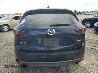 2017 Mazda CX-5 Grand Touring with VIN JM3KFADL2H0221149, listed as a Copart auction lot 50606915 with 140,518 mi miles and Clean Title. Bid and sale history available at carsss.com. Image 6.
