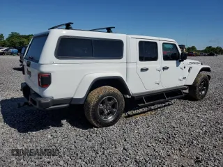 2023 Jeep Gladiator Rubicon with VIN 1C6JJTBG9PL546437, listed as a Copart auction lot 55516685 with 14,106 mi miles and Salvage title. Bid and sale history available at DreamBid. Image 3.