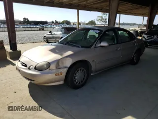 1998 Ford Taurus SE Comfort with VIN 1FAFP53S3WG213045, listed as a Copart auction lot 61653315 with 111,014 mi miles and Salvage title. Bid and sale history available at DreamBid. Image 1.