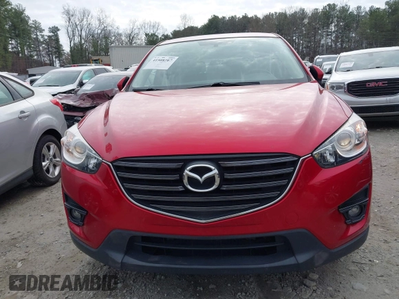 2016 Mazda CX-5 Touring z VIN JM3KE2CY3G0894441, wystawiony jako IAAI lot #41508767 z przebiegiem 88 554 mil mil oraz . Historia ofert i sprzedaży dostępna na DreamBid. Obrazek 12.