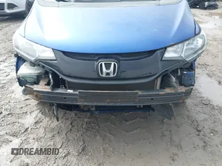 2015 Honda Fit LX with VIN 3HGGK5H52FM710434, listed as a IAAI auction lot 42022022 with 104,118 mi miles. Bid and sale history available at carsss.com. Image 6.