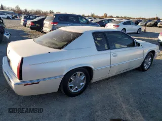 2002 Cadillac Eldorado z VIN 1G6EL12Y12B100821, wystawiony jako Copart lot #83495214 z przebiegiem 36 358 mil mil oraz Czysty tytuł • Clean title. Historia ofert i sprzedaży dostępna na DreamBid. Obrazek 3.