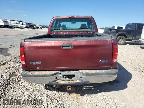 2000 Ford F-350 XL with VIN 1FTSW30F6YEB89796, listed as a Copart auction lot 67490144 with 517,242 mi miles and Salvage Title. Bid and sale history available at DreamBid. Image 6.