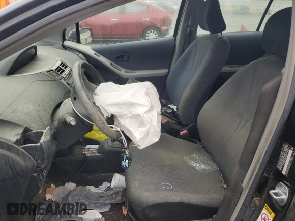 2009 Toyota Yaris with VIN JTDKT903095243922, listed as a Copart auction lot 51293545 with 196,909 mi miles and Salvage Title. Bid and sale history available at carsss.com. Image 7.