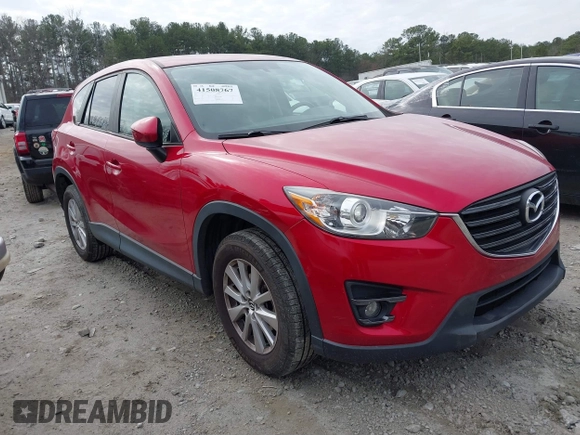 2016 Mazda CX-5 Touring z VIN JM3KE2CY3G0894441, wystawiony jako IAAI lot #41508767 z przebiegiem 88 554 mil mil oraz . Historia ofert i sprzedaży dostępna na DreamBid. Obrazek 1.