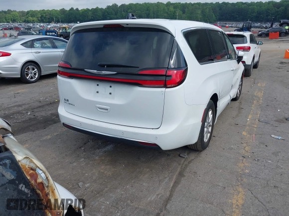 2023 Chrysler Pacifica Touring L with VIN 2C4RC1BG8PR535446, listed as a IAAI auction lot 42307923 with 65,718 mi miles and . Bid and sale history available at DreamBid. Image 4.