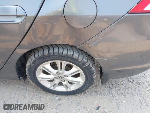 2010 Honda Insight EX with VIN JHMZE2H75AS027964, listed as a IAAI auction lot 41889301 with 136,485 mi miles and . Bid and sale history available at DreamBid. Image 6.