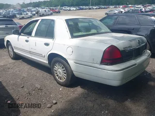 2008 Mercury Grand Marquis LS with VIN 2MEFM75VX8X600015, listed as a IAAI auction lot 42142359 with 310,481 mi miles and . Bid and sale history available at DreamBid. Image 3.