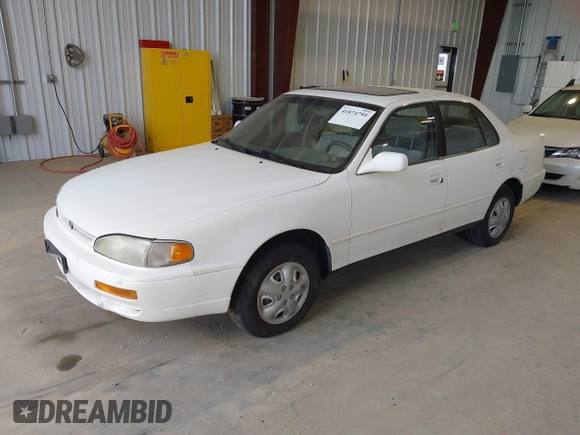 1996 Toyota Camry DX with VIN JT2BG12K3T0401659, listed as a IAAI auction lot 41874795 with 169,406 mi miles. Bid and sale history available at carsss.com. Image 2.