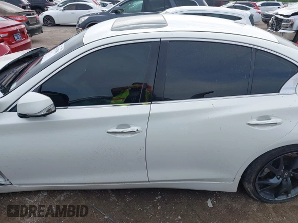 2015 Infiniti Q50 Premium z VIN JN1BV7APXFM352327, wystawiony jako IAAI lot #42367983 z przebiegiem 110 636 mil mil oraz . Historia ofert i sprzedaży dostępna na DreamBid. Obrazek 14.